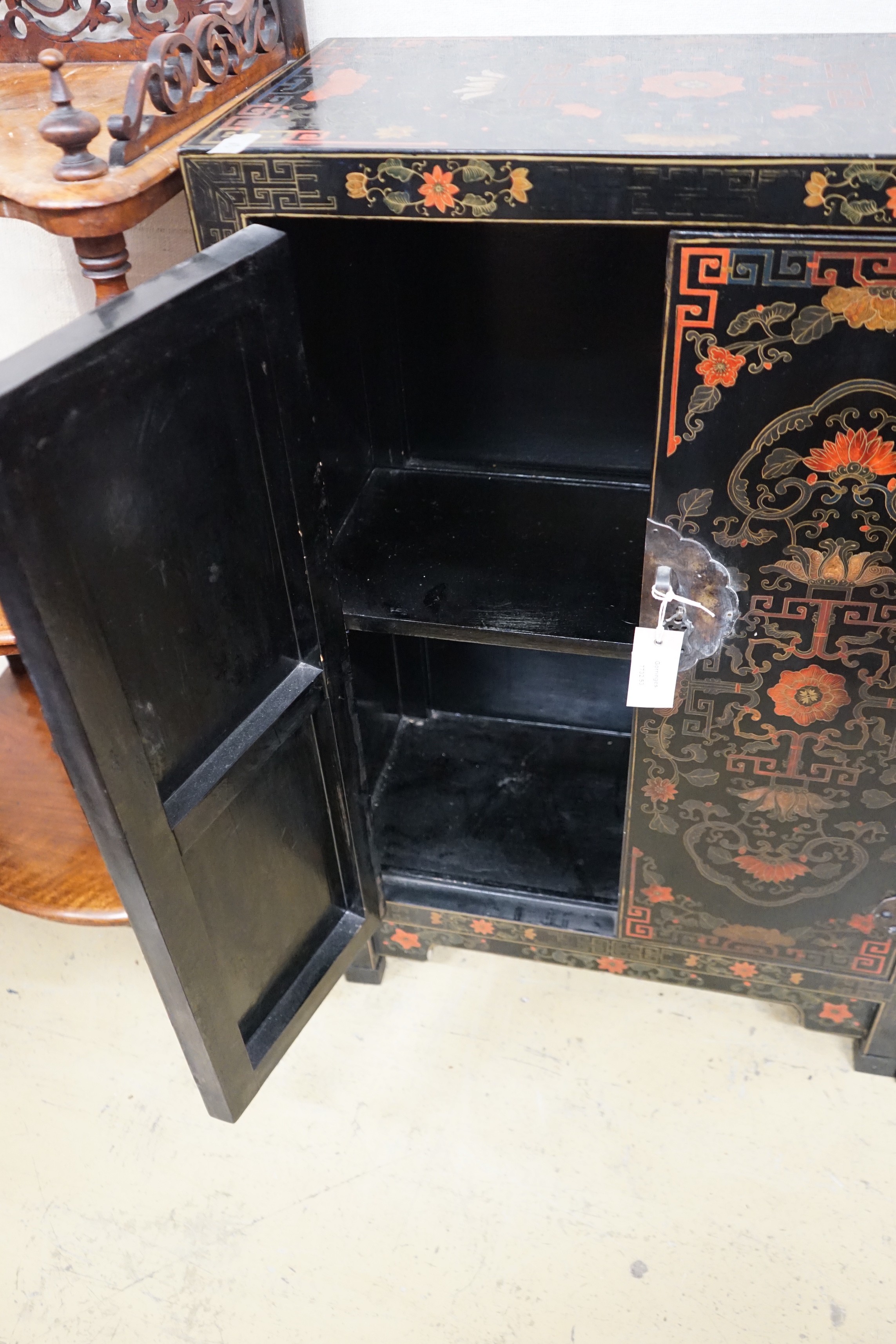 A pair of Chinese painted two door side cabinets, width 61cm, depth 31cm, height 93cm